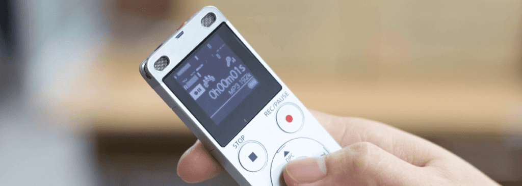dictaphone in hand