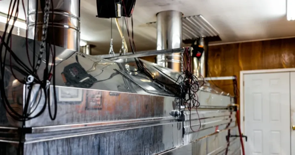 Stainless steel industrial machine making maple syrup.